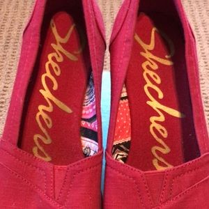 Skechers red wedges.